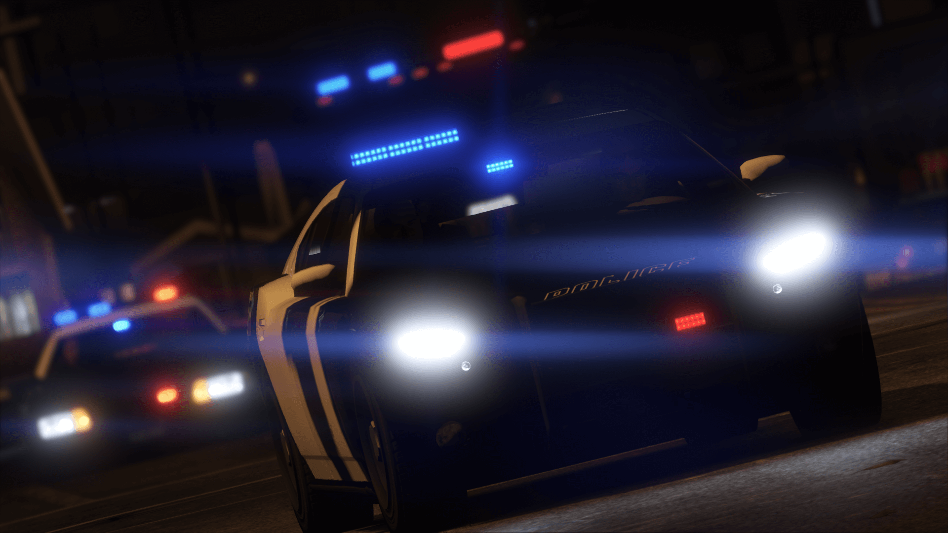 A GTA 5 police charger with its lights on.